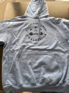 Grey Sweat Shirt with Black Get Strong Apparel Logo on the front. 